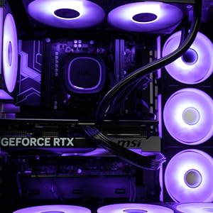 Text reads 'GEFORCE RTX'. Purple-lit computer tower interior with graphics card, multiple fan units, and RGB lighting components visible.
