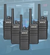 Two black walkie-talkies with charging cables and bases displayed on blue background.