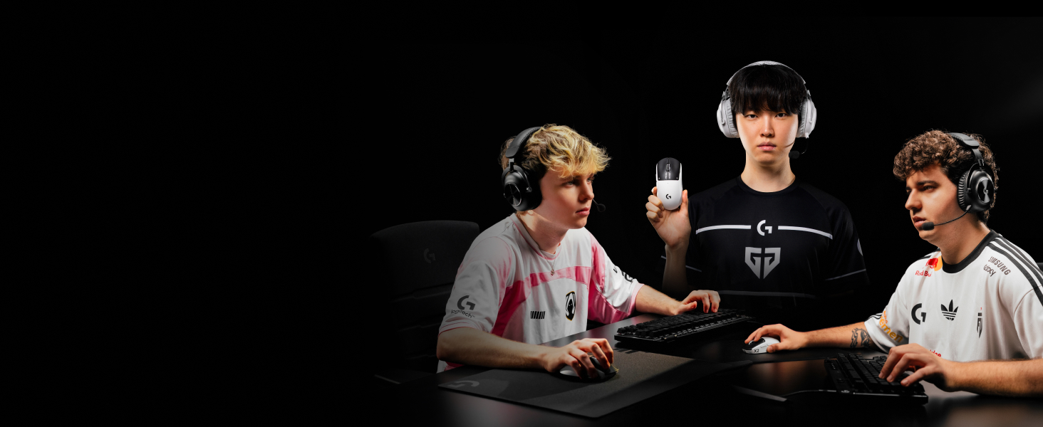 Dramatic gaming scene against black background showing three people in gaming headsets interacting with gaming equipment.