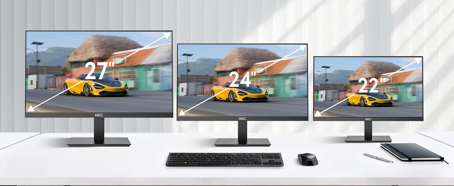 Three identical computer monitors displaying the same image of construction vehicle, demonstrating monitor display consistency across multiple screens.