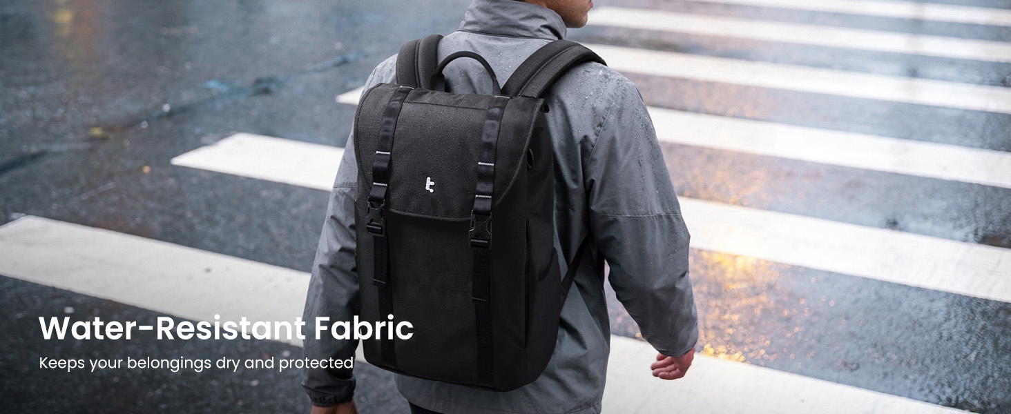 Text reads 'Water-Resistant Fabric'. Person wearing black backpack crossing pedestrian crossing, demonstrating water-resistant material durability.