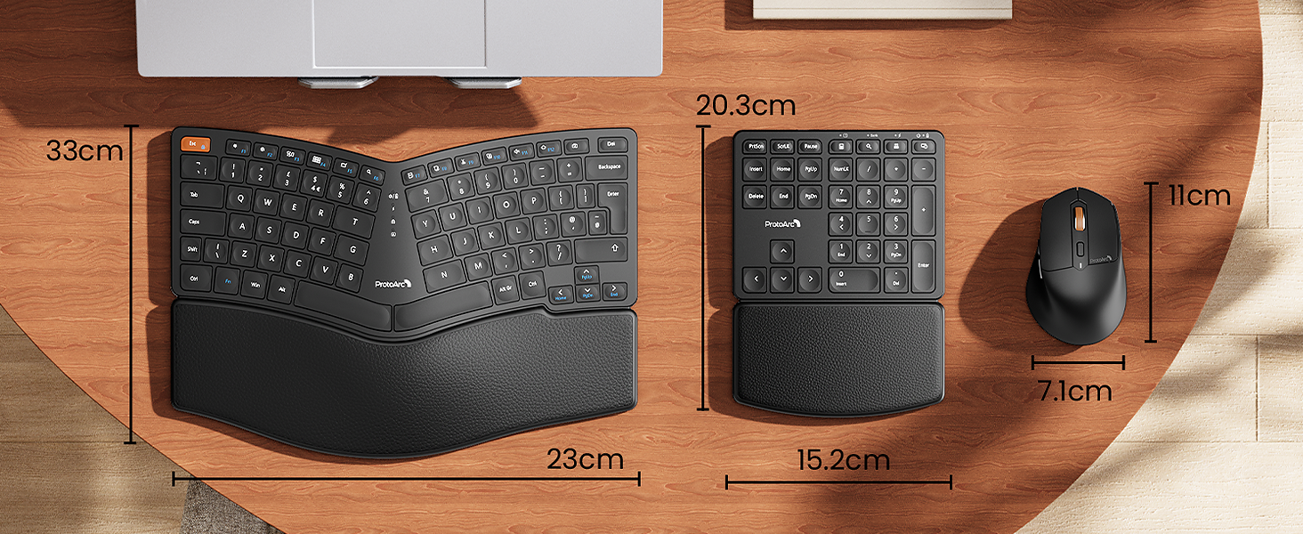 Ergonomic computer peripherals: split keyboard with palm rest, separate numeric keypad, and wireless mouse. Measurements shown for each device on wooden surface.