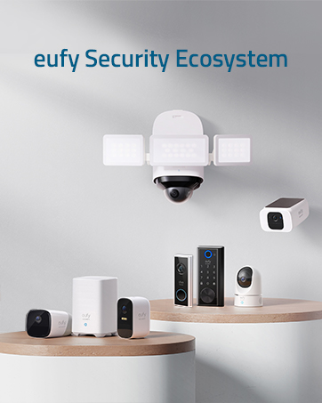 White wireless security camera with solar panel on top. Rectangular body, round lens, and blue indicator light. Features 2K resolution and Eufy branding.