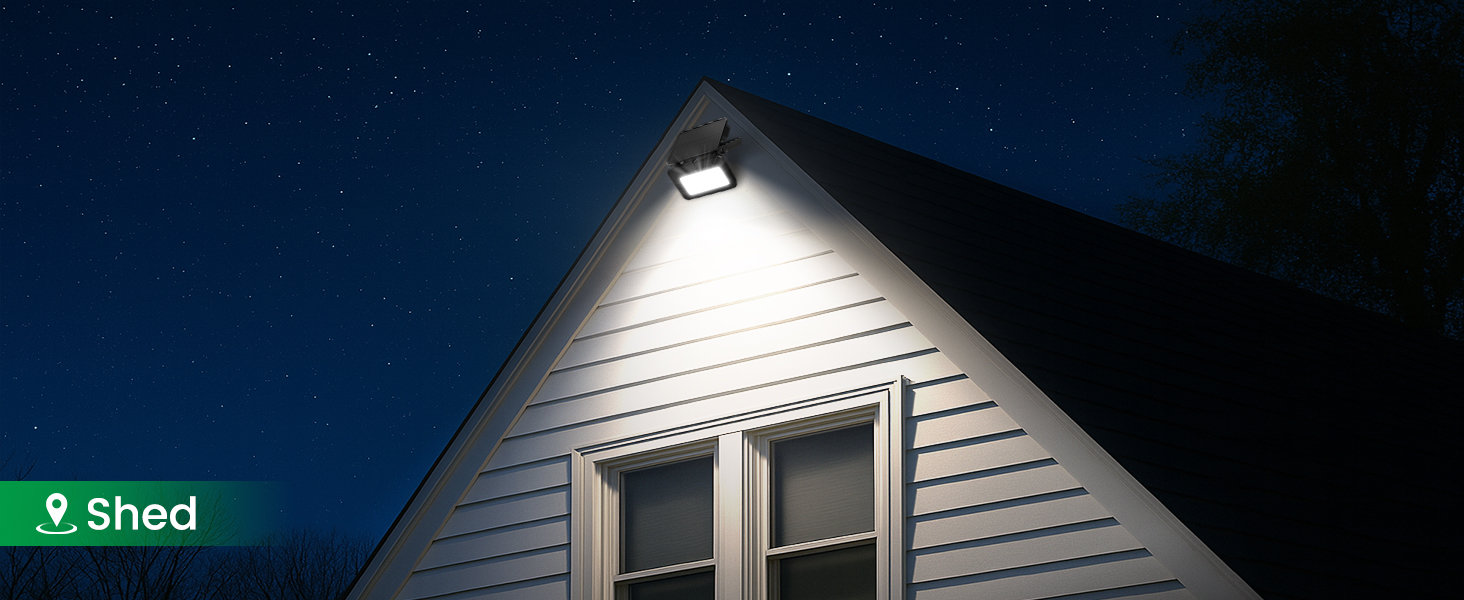 Night view of house exterior showing illuminated gable and siding with text overlay reading 'Shed'.