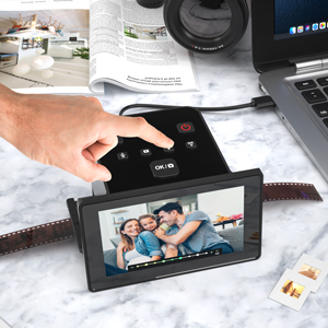 Text reads 'Convenient Easy-Load Film Inserts' with description 'The Scanner has a space-feeding tray'. Black film cartridge holder with multiple slots, product design showcase of convenient film loading system.