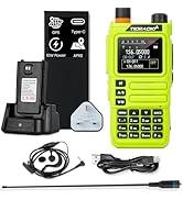 Dual-band portable radio transceiver. Black handheld device with similar layout to Image 4, featuring LCD display, keypad, includes matching charging dock, battery, headset with microphone, power cable, and antenna.