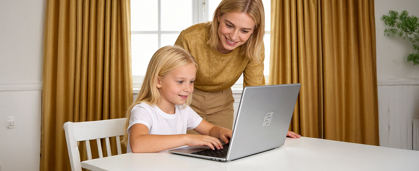 Scene showing computer usage at a wooden table with gold curtains in background. Laptop visible on white table surface.