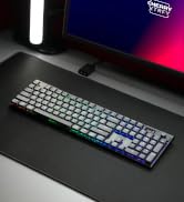 RGB mechanical keyboard with illuminated keys being operated in low-light conditions, showing colorful key backlighting.