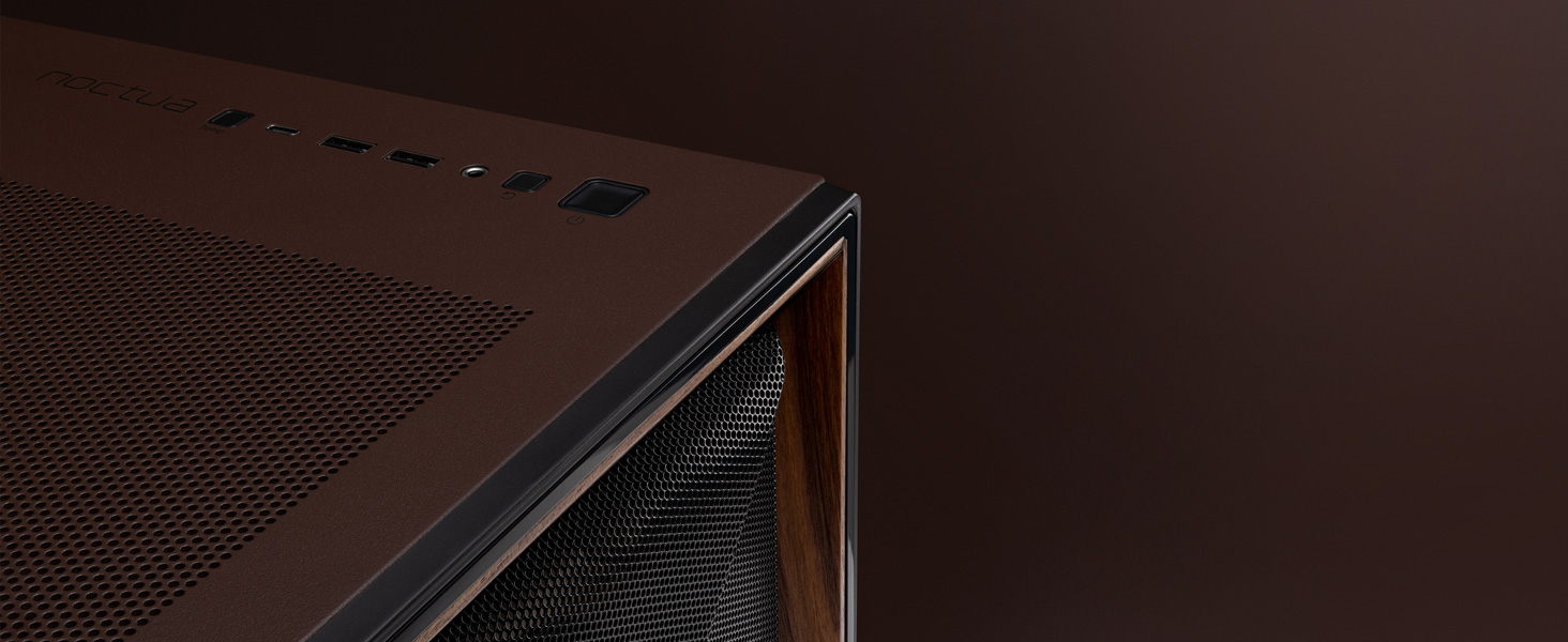 Close-up view of dark brown perforated surface, appears to be part of an electronic device or enclosure.