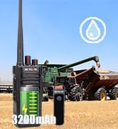 Two-way radios with extended antennas displayed in front of a green tent, with '48mm' text visible, suggesting outdoor communication equipment.