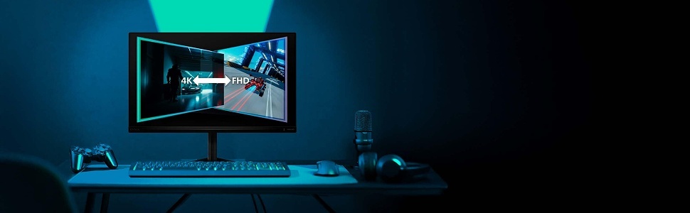 Blue-lit gaming or professional setup showing monitor displaying content, keyboard, and desk accessories in dark atmospheric environment. Computer workstation display.