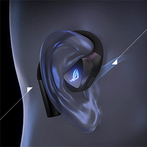 Close-up view of an ear wearing a red triangle-shaped stud earring against a dark background.