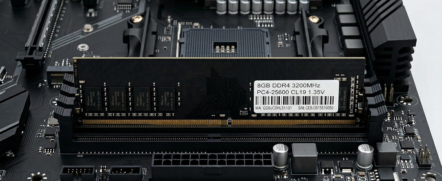 Computer motherboard with RAM module installed, featuring black circuitry, white barcode label, and multiple connection ports.