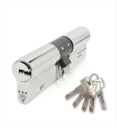 Brass or gold-colored door lock cylinder with multiple keys shown from different angles. Security hardware demonstration.