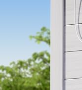 Close-up of white wall mounted storage or organizational system showing minimal clean lines and surfaces.