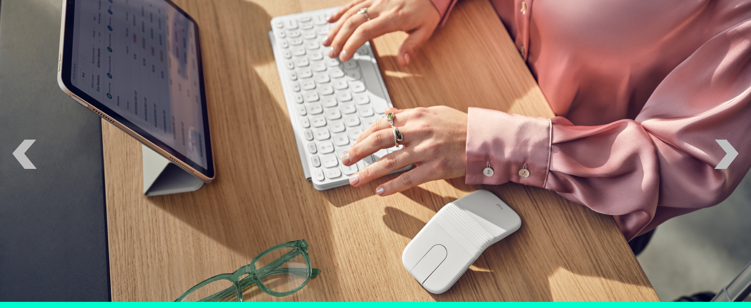 Split image showing hands holding white rectangular device near wooden desk surface, and separate detail of device placement on table with notebook visible.