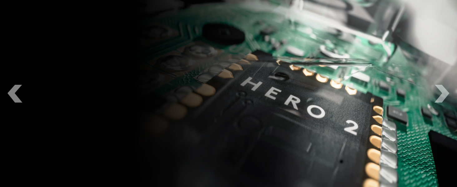 Close-up macro shot of circuit board or electronic component with green PCB surface and metallic connections visible.