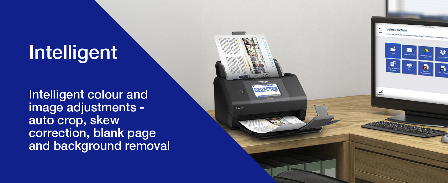 Text reads 'Intelligent' and 'Intelligent colour and image adjustments – automatic colour correction, blank page and background removal.' Desktop scanner device on wooden desk with blue control panel and display screen visible in office setting.