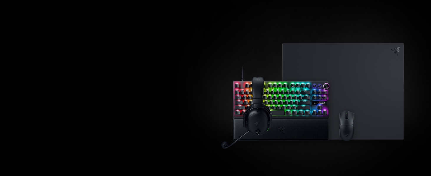 Dark product image showing illuminated mechanical keyboard with RGB backlighting and multi-colored keys displayed against black background.