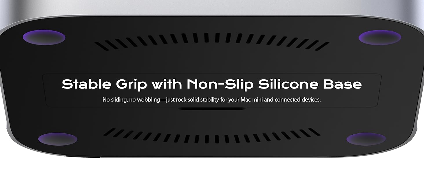 Text reads 'Stable Grip with Non-Slip Silicone Base'. Black gaming or computer device with curved edges and purple accent lights or indicators on corners.
