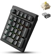 Black mechanical keyboard with gray keycaps and green accent keys, shown at angle with separate switch mechanism and stabilizer components displayed.