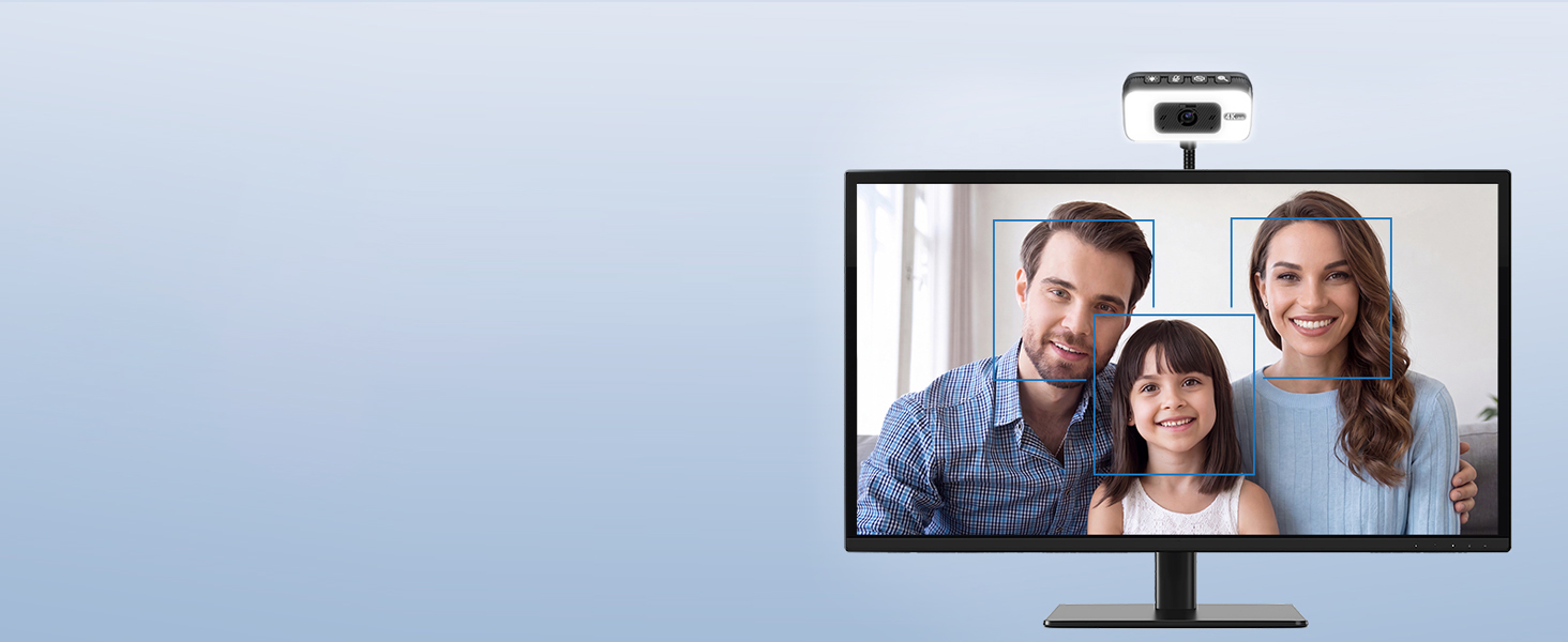 Computer monitor displaying video call with four people visible on screen against light blue background, monitor has black stand and top-mounted camera.