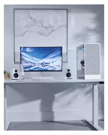 Modern entertainment setup showing a wall-mounted flat-screen TV with soundbar and speakers against a white marble-textured wall background.