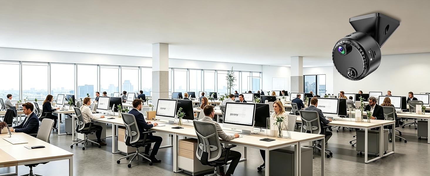 Modern open-plan office workspace with multiple employees at desks, bright natural lighting, and professional work environment with industrial ceiling and contemporary furniture.