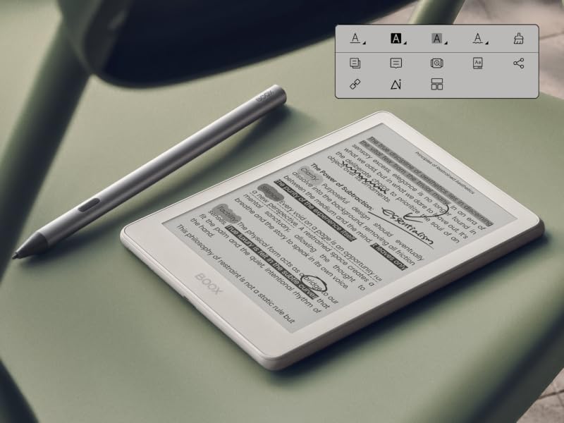 E-reader tablet displaying text document with stylus pen resting on screen against green fabric surface.