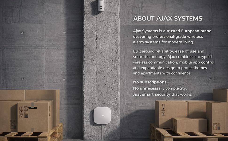 Text reads 'ABOUT AJAX SYSTEMS'. Industrial warehouse or storage setting with cardboard boxes against concrete wall with technical text overlay.