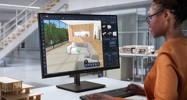 Desktop monitor displaying 3D architectural interior rendering with construction/design software interface. Person in orange shirt seated at desk with keyboard and mouse, modern office workspace with stairs visible.