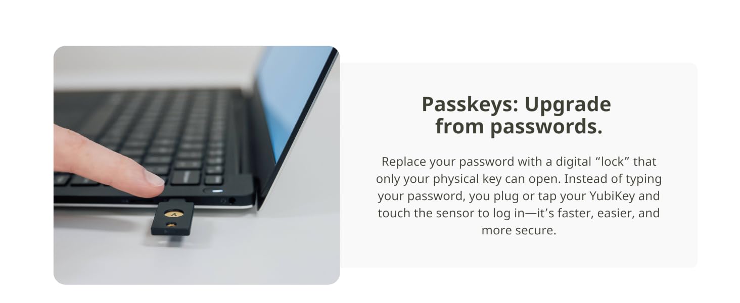 Text reads 'Passkeys: Upgrade from passwords. Replace your password with a sign-in code or authentication method for better security.' Hand on laptop keyboard shown.